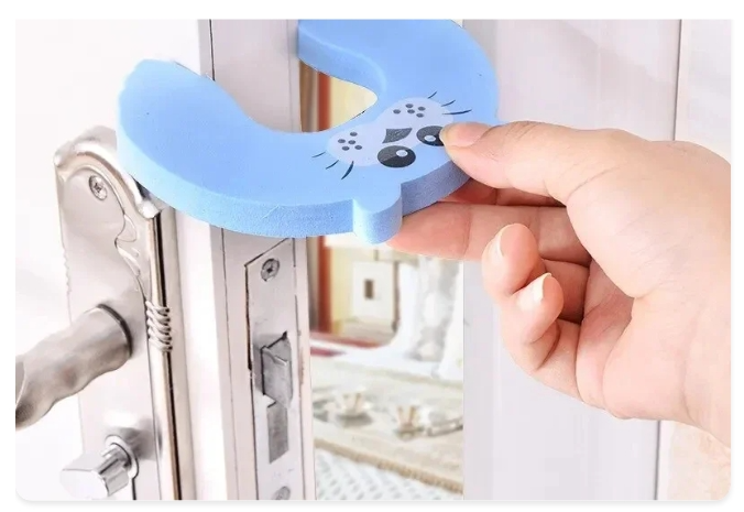 A blue foam guard being fitted to a door